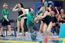 Gary O'Brien is pushed into the water in celebration after the match by Roisin Cunningham-Smyth and Mairead Baker 21/5/2023 