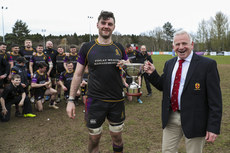 Paul Hart presents Instonians Captain Eoghan Murphy with the Division 2C cup 1/4/2023