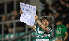 A young Rovers fan holds a sign 19/5/2023 