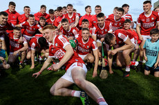 Ross O'Sullivan dives in for the team photo with the Munster U20 trophy 15/5/2023 