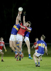 Steven O'Brien and Cathal Kennedy are challenged in the air by Brian Hartnett 2/1/2020