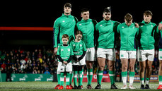 Evan O’Connell with Match day Mascots Fionn Cantwell and Emily Clendenning with Stephen Smyth, Jacob Boyd, Jack Murphy and Hugo McLaughlin during the national anthems 9/2/2024