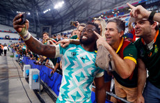 Siya Kolisi takes selfies with fans after the game 10/9/2023