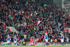 Cliftonville fans celebrate after their team score to make it 1-1 4/5/2024