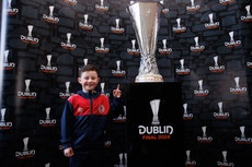 Cillian Mulraney poses for a photo with the Europa League Trophy ahead of the game 19/4/2024