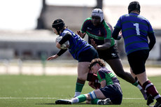 Robbie McArdle is tackled by Eoin Healy and Emmanuel Makinde 24/4/2024