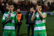 Darragh Burns and Lee Grace applaud the traveling fans at the end of the game 19/4/2024