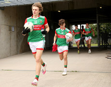 Diarmuid Duffy and Ronan Clarke run out to the pitch ahead of the game 25/6/2022