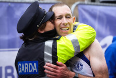 Cathal Henry receives a hug from his wife Garda Fiona Byrne after completing the marathon 27/10/2024