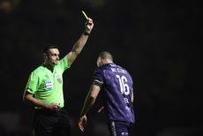 Rob Hennessy shows Shane McEleney a yellow card 25/10/2024