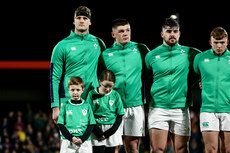 Evan O’Connell with Match day Mascots Fionn Cantwell and Emily Clendenning with Stephen Smyth, Jacob Boyd, Jack Murphy during the national anthem 9/2/2024