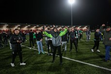 Shamrock Rovers fans are moved onto the pitch after the game after missiles were thrown from outside the ground 19/4/2024