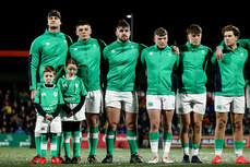 Evan O’Connell with Match day Mascots Fionn Cantwell and Emily Clendenning with Stephen Smyth, Jacob Boyd, Jack Murphy, Hugo McLaughlin and Wilhelm de Klerk during the national anthem 9/2/2024