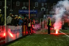 A flare lands on the edge of the pitch after it was thrown over the top of the Shamrock Rovers’ fans 19/4/2024