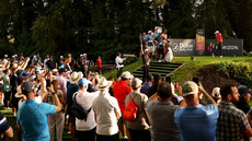 Fans look on as Rory McIlroy tees off the 17th 8/9/2023