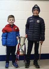 Brothers Freddie and Jimmy Burke with the Tommy Moore cup before the game 3/2/2024