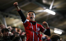 A Derry fan celebrates the first goal 15/9/2023
