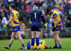 Conor Daly injured as Niall Daly, goalkeeper Conor Carroll and Brian Stack look on 9/4/2023