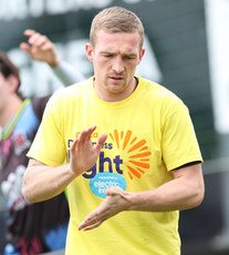 John Mountney warms up ahead of the game in a Darkness Into Light branded t-shirt 6/5/2024