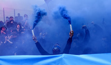 A Drogheda fan with flares during the game 1/4/2024