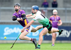 Cian O'Cathasaigh is challenged by Paul Crummey 13/10/2024