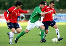 Daniel Corcoran tackled by Bastian Arce and Charles Aranguiz 9/8/2007