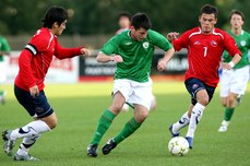 Daniel Corcoran tackled by Bastian Arce and Charles Aranguiz 9/8/2007