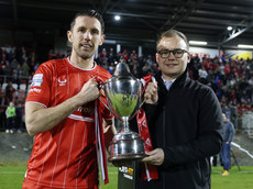 Gary Thompson is presented with the trophy by Darren McPolin from Player-Fit 26/4/2024