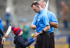 Luke Gleeson, aged 4, receives a match sliotar from his father and referee for the game Thomas Gleeson 13/10/2024