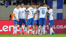 Anastasios Bakasetas celebrates scoring his sides first goal with teammates 13/10/2024