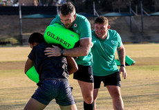 Peter O’Mahony and Tadhg Furlong with a member of the team 3/7/2024