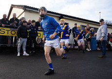 Loughrea players make their way out 10/11/2024