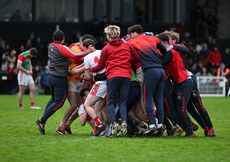 Coolera Stranhill players celebrate with Ross Doherty after he scored the winning penalty 17/11/2024