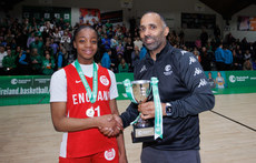 Irene Oboavwoduo is presented with the trophy by Matthew Hall 27/3/2024