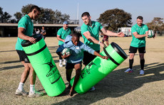 Cormac Izuchukwu and Nick Timoney with members of the team 3/7/2024