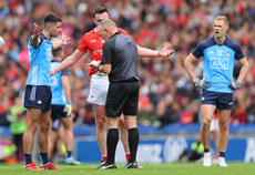 Tommy Durnin and Niall Scully of Dublin speak with referee Conor Lane 14/5/2023 