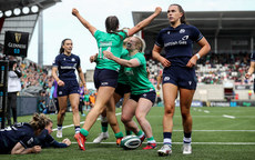 Katie Corrigan celebrates scoring her sides first try with Aoibheann Reilly and Neve Jones 27/4/2024