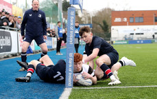 Mícheál Cooper is tackled by Ross Collins and Johnny Woods 9/2/2024