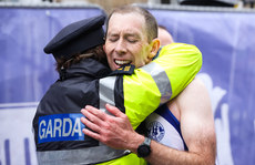 Cathal Henry receives a hug from his wife Garda Fiona Byrne after completing the marathon 27/10/2024