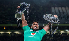 Bundee Aki celebrates winning with the Guinness Six Nations and Triple Crown trophies 18/3/2023