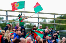A young Mayo fan waves flags in the stands at Elvery's MacHale Park 11/7/2021