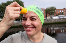 A competitor applies sun cream ahead of the race 7/9/2024
