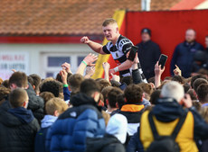 Rory O'Shaughnessy celebrates at the end of the game with supporters 14/3/2023
