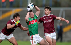 Matthew Ruane is tackled by Cillian McDaid and Michael Daly 18/10/2020
