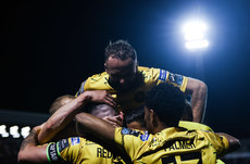 Joe Redmond is congratulated by teammates after scoring his side's third goal of the match 14/10/2024